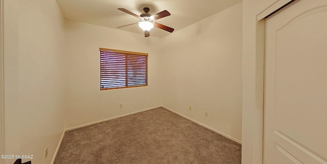 unfurnished room featuring ceiling fan and carpet