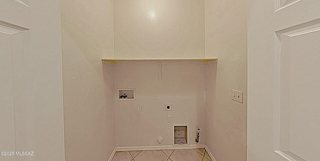 clothes washing area featuring electric dryer hookup, hookup for a gas dryer, hookup for a washing machine, and tile patterned floors