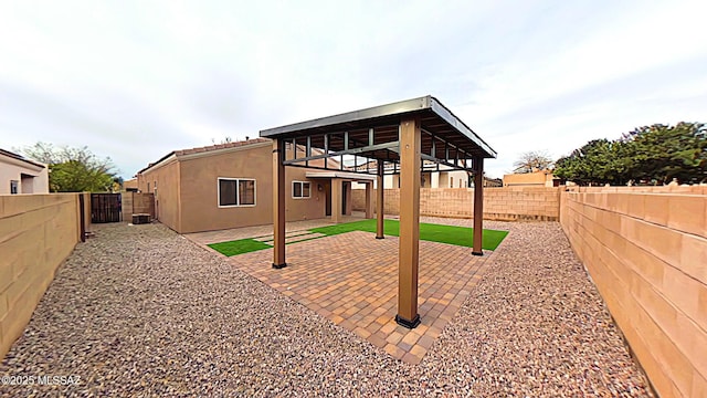 rear view of property with a patio area