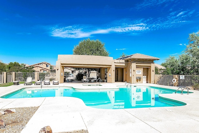 view of swimming pool with a patio area