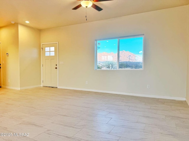empty room with baseboards, a ceiling fan, and recessed lighting