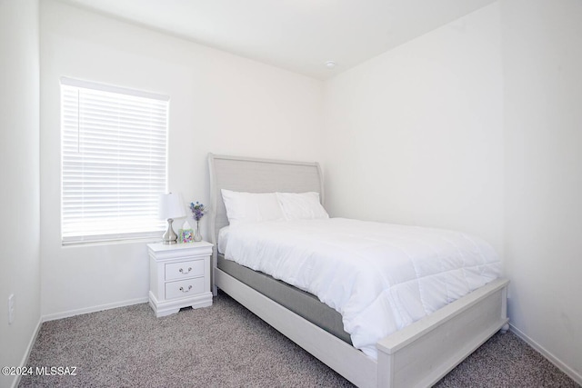 bedroom featuring light carpet