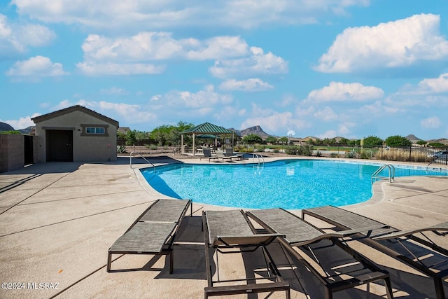 view of pool featuring a gazebo and a patio