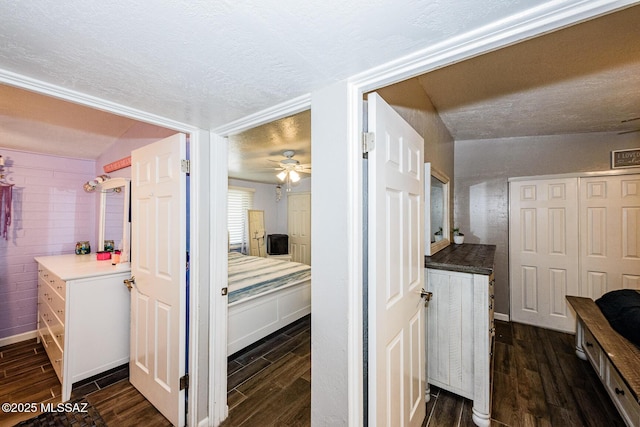 hall with a textured ceiling