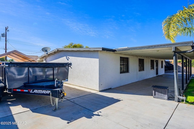 view of side of property featuring a carport