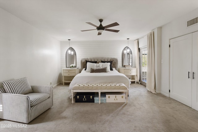 bedroom featuring light colored carpet and ceiling fan