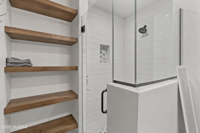 bathroom with a shower with shower door