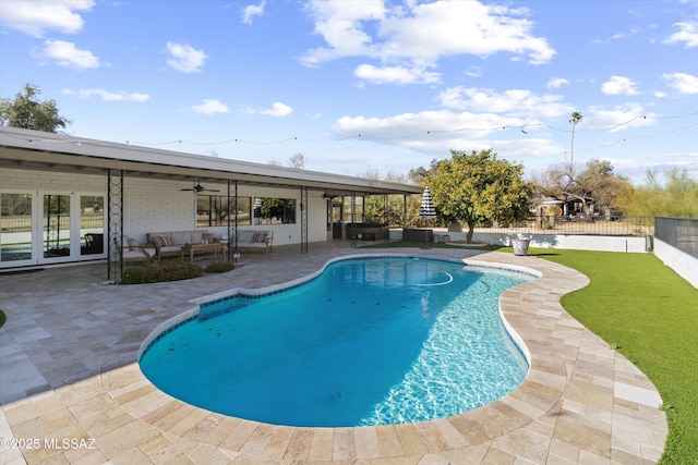 view of pool featuring a patio area, outdoor lounge area, and ceiling fan