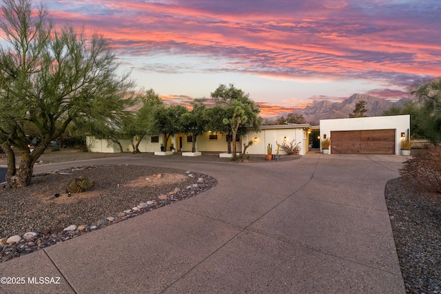 pool at dusk featuring a patio