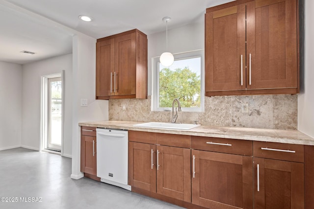kitchen with white dishwasher, a sink, tasteful backsplash, brown cabinetry, and recessed lighting