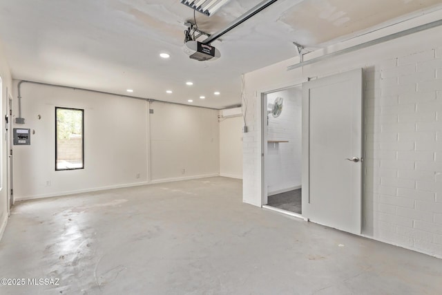 garage featuring a garage door opener and recessed lighting