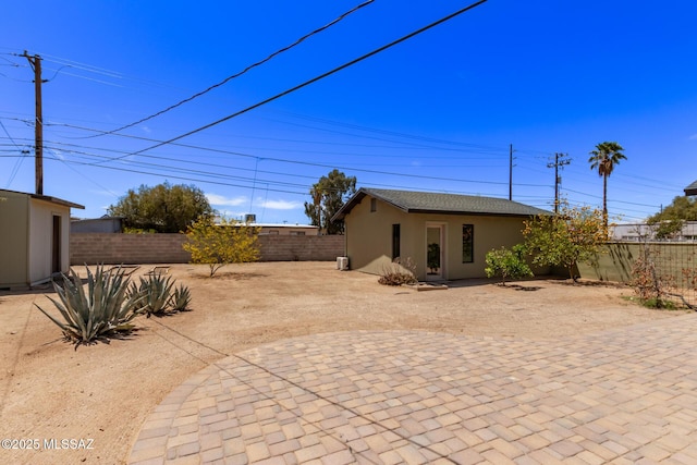 fenced backyard with a patio