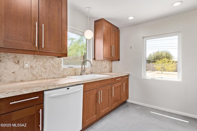 kitchen featuring dishwasher, a sink, backsplash, baseboards, and brown cabinetry