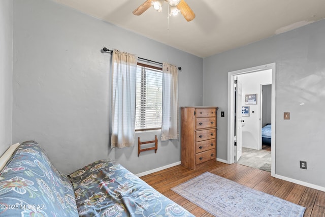 bedroom featuring wood-type flooring and ceiling fan