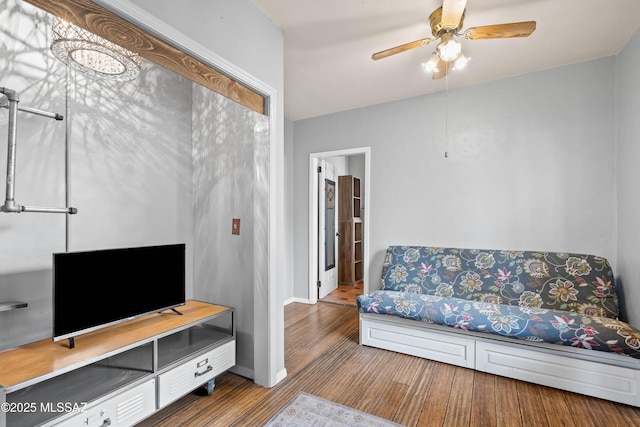 living room featuring hardwood / wood-style flooring and ceiling fan