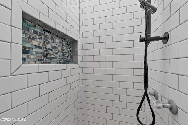 bathroom featuring tiled shower