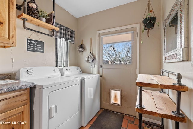 washroom with cabinets and separate washer and dryer