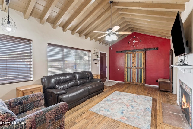 living room with ceiling fan, high vaulted ceiling, wood-type flooring, wooden ceiling, and beamed ceiling