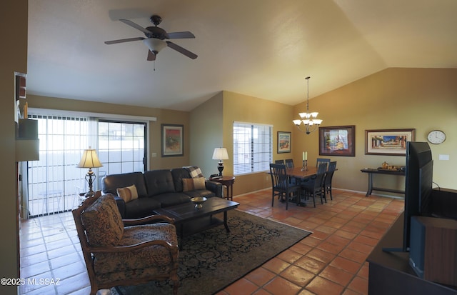 tiled living area with lofted ceiling and ceiling fan with notable chandelier