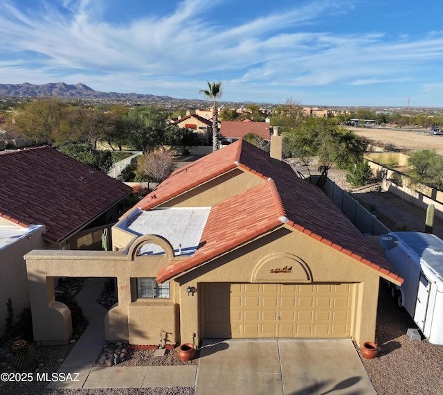 birds eye view of property with a mountain view