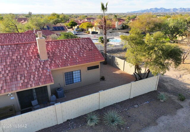 view of front of property featuring a mountain view, driveway, an attached garage, and stucco siding