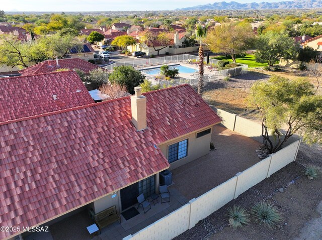 view of front of property with driveway, a garage, a mountain view, and stucco siding