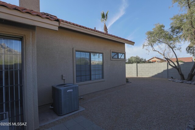 back of house with a patio, fence, a mountain view, and stucco siding