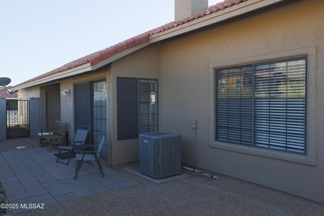 exterior space featuring a fenced backyard and central air condition unit