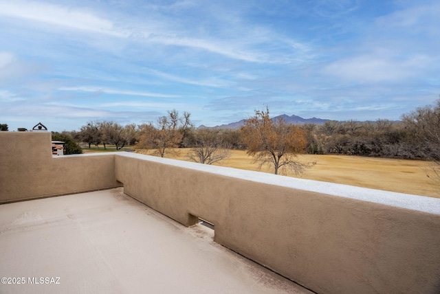 balcony featuring a mountain view