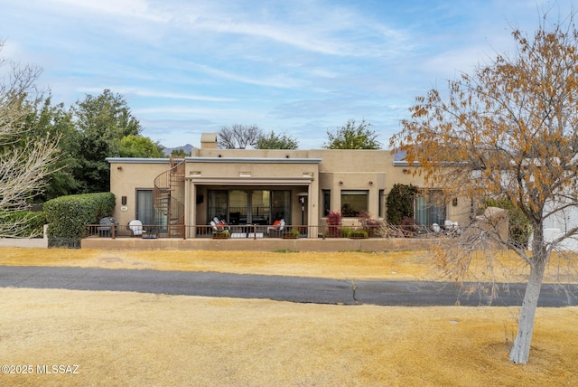 view of adobe home