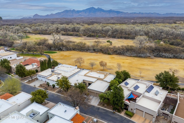 birds eye view of property featuring a mountain view