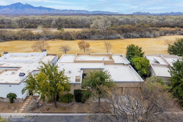 drone / aerial view featuring a mountain view