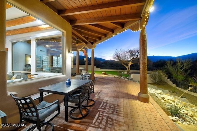 12342 E Barry Baker Pl, Tucson, AZ 85749 - view of patio with outdoor dining area, a mountain view, and fence