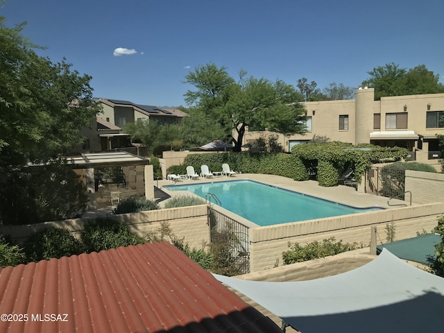 view of pool featuring a patio