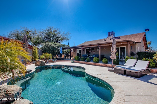 outdoor pool with a patio