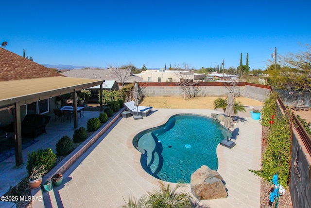 view of swimming pool featuring a fenced backyard, a fenced in pool, and a patio