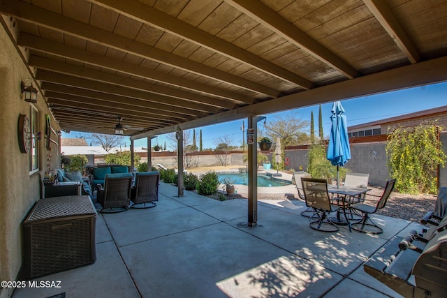 view of patio featuring outdoor dining area, a fenced backyard, an outdoor living space, and a fenced in pool