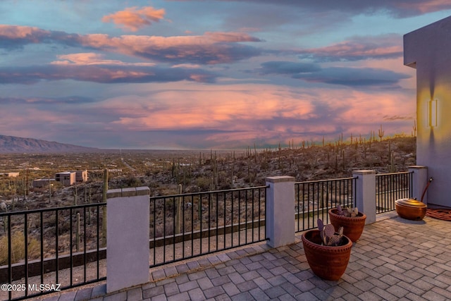 view of patio / terrace featuring a balcony and a mountain view