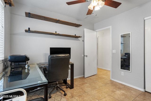 tiled office space featuring ceiling fan