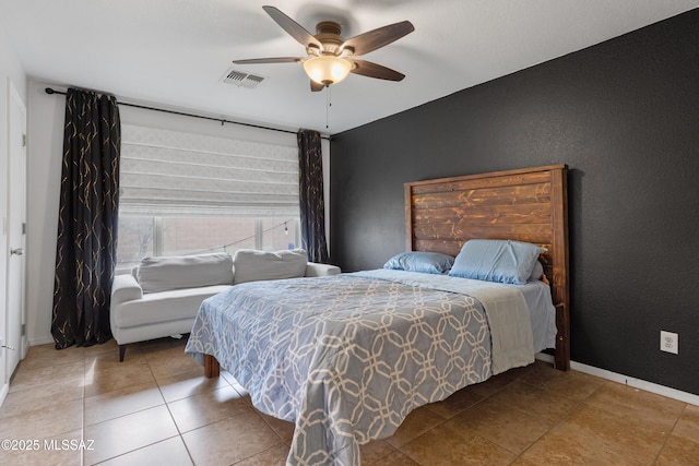 bedroom with tile patterned floors and ceiling fan