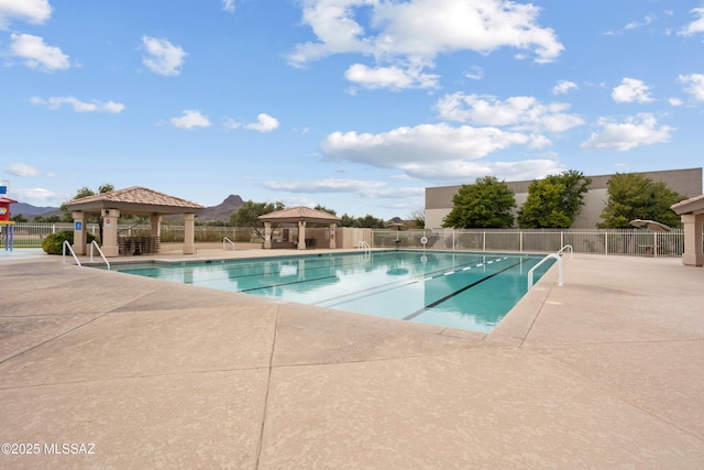 view of swimming pool with a gazebo and a patio