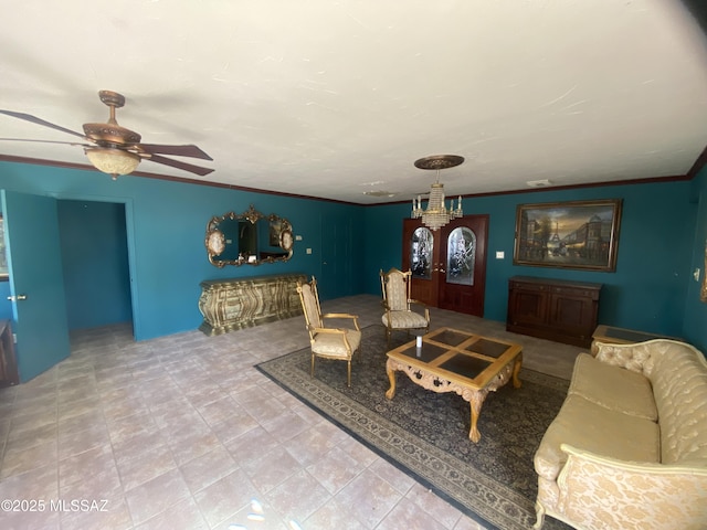 living room with crown molding and ceiling fan