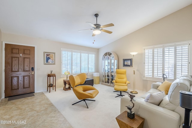 36425 S Golf Course Dr, Tucson, AZ 85739 - carpeted living area featuring vaulted ceiling, plenty of natural light, tile patterned floors, and ceiling fan