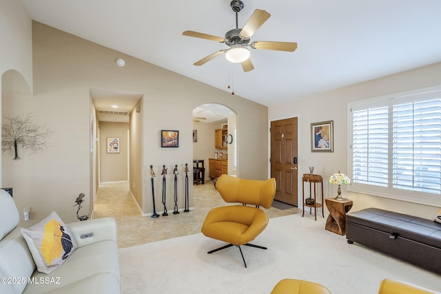 36425 S Golf Course Dr, Tucson, AZ 85739 - living room with arched walkways, visible vents, a ceiling fan, and lofted ceiling