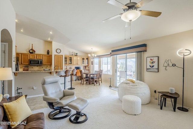 36425 S Golf Course Dr, Tucson, AZ 85739 - living area with light colored carpet, lofted ceiling, light tile patterned floors, recessed lighting, and ceiling fan with notable chandelier
