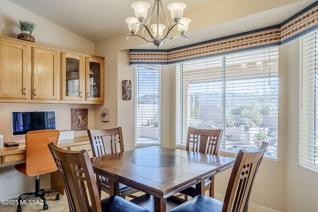 36425 S Golf Course Dr, Tucson, AZ 85739 - dining room with an inviting chandelier and vaulted ceiling