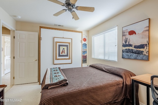 36425 S Golf Course Dr, Tucson, AZ 85739 - bedroom with visible vents, light carpet, and ceiling fan