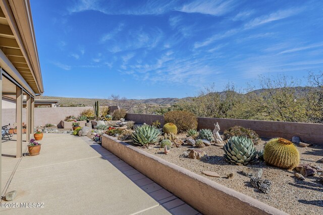 36425 S Golf Course Dr, Tucson, AZ 85739 - view of patio / terrace featuring a mountain view and a fenced backyard