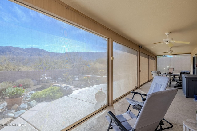 36425 S Golf Course Dr, Tucson, AZ 85739 - sunroom featuring a mountain view and ceiling fan