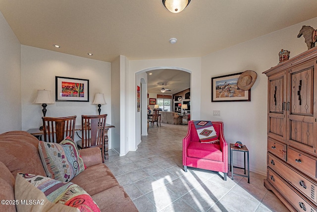 sitting room featuring ceiling fan and light tile patterned flooring